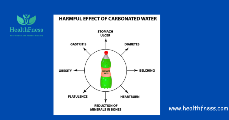 A glass of fizzy carbonated water with a slice of lemon on the side is served.